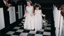 Emily and Courtney down Aisle