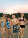 Kids Swimming at Sunset