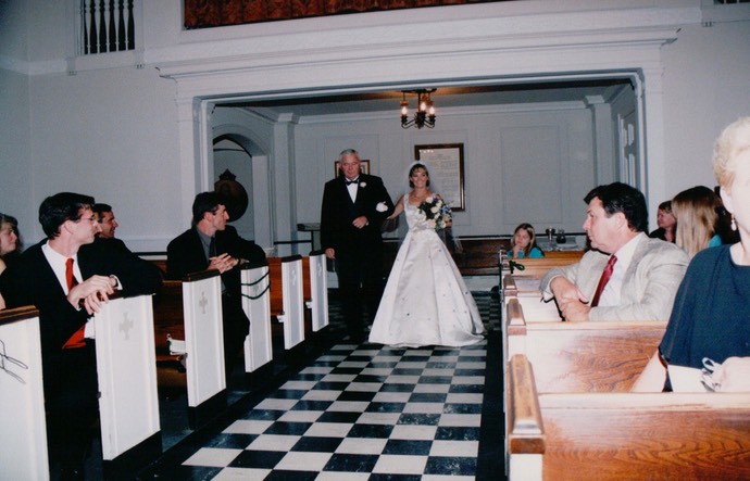 Lori's Dad walking Lori down Aisle