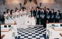 Wedding Party Looking at Couple